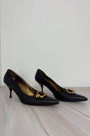 Prada Noir Gold Emblem Pumps